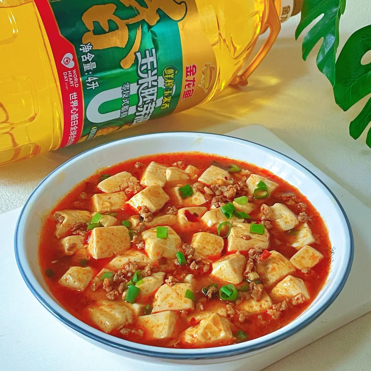 Cubes of white silken tofu in a red chilli sauce topped with minced pork and scallion