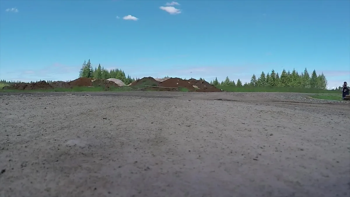 Small drone in flight against an open sky